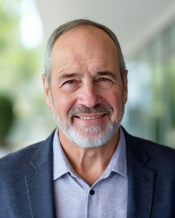 James Merrifield managing partner at MPV Properties mature man with beard and a sports coat smiling inside