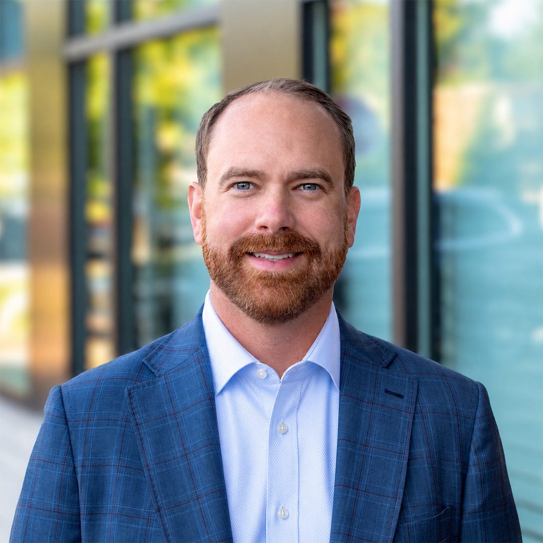 Joey Morganthall retail broker man with red beard smiling outside