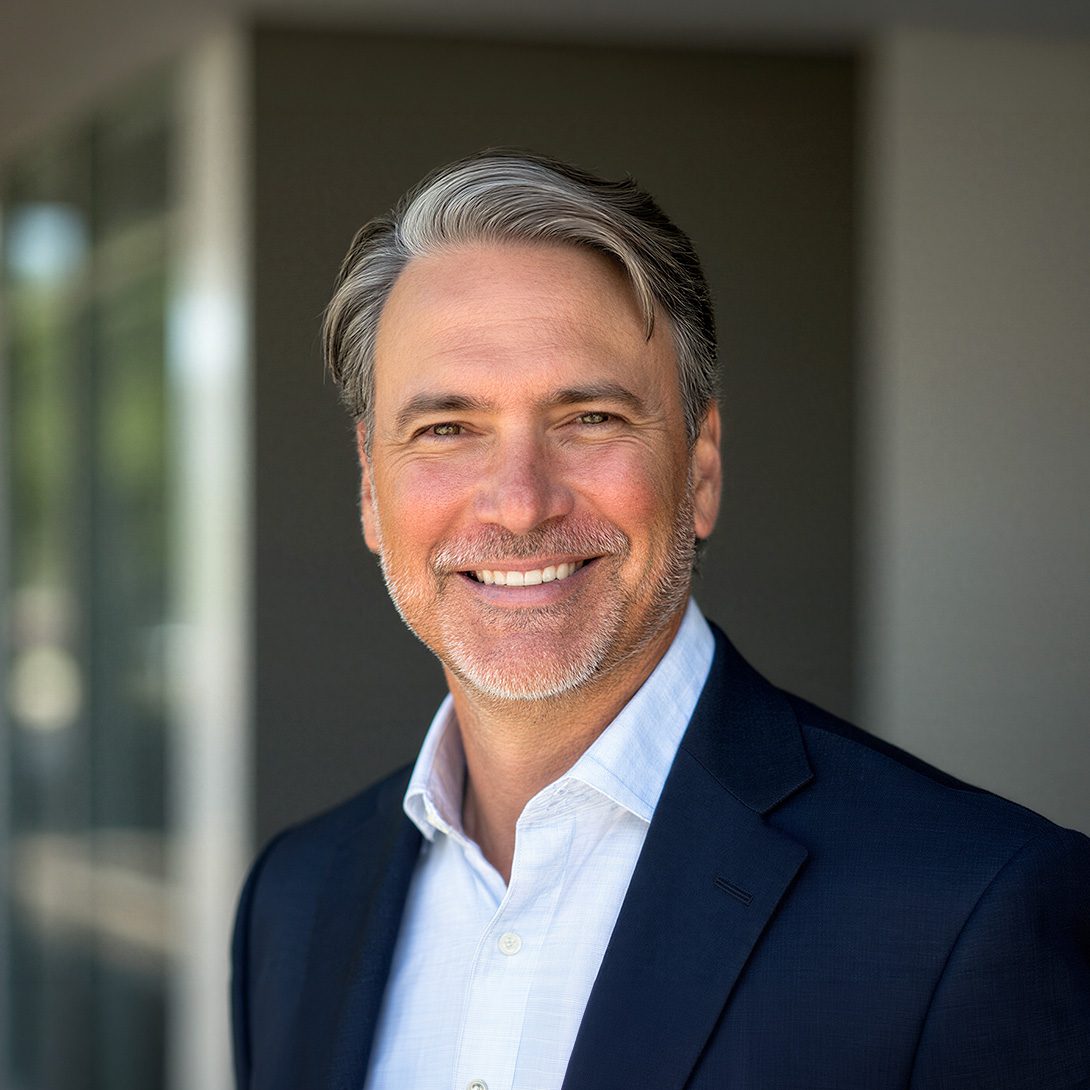 Justin Holofchak, businessman smiling outside