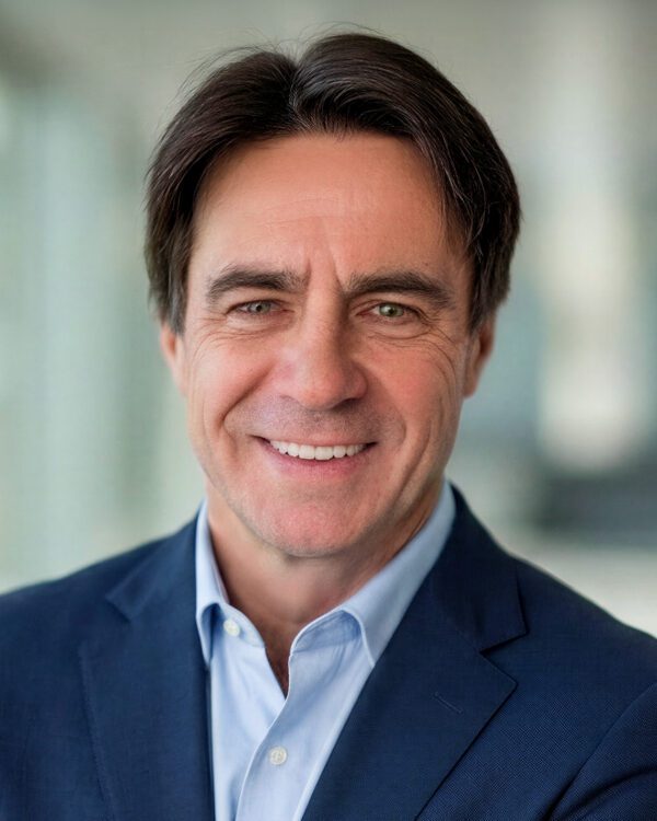 Mike Bilodeau development partner businessman smiling inside an office