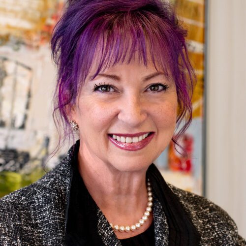 Sheila Proctor Association Manager at MPV Properties woman with purple hair in business attire