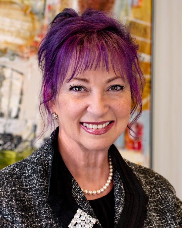 Sheila Proctor Association Manager at MPV Properties woman with purple hair in business attire