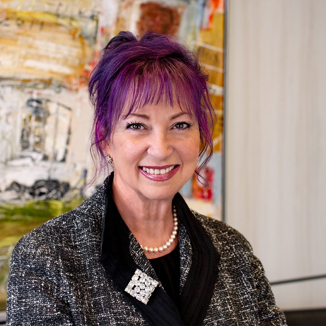 Sheila Proctor Association Manager at MPV Properties woman with purple hair in business attire