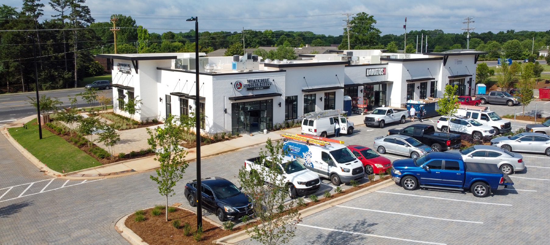 Aerial drone photograph of white commercial building