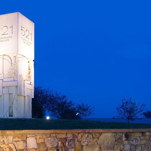 521 Corporate Center monument concrete pillar with evening blue sky