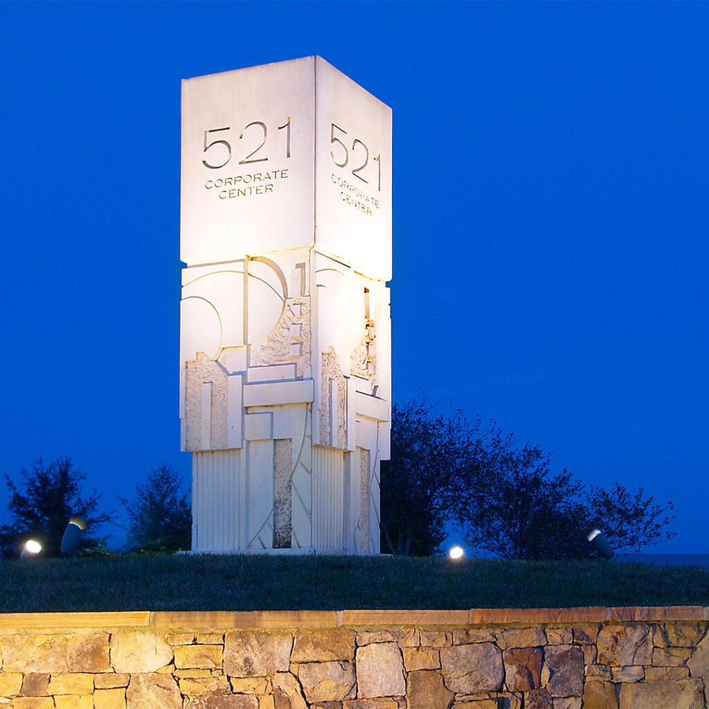 521 Corporate Center monument concrete pillar with evening blue sky