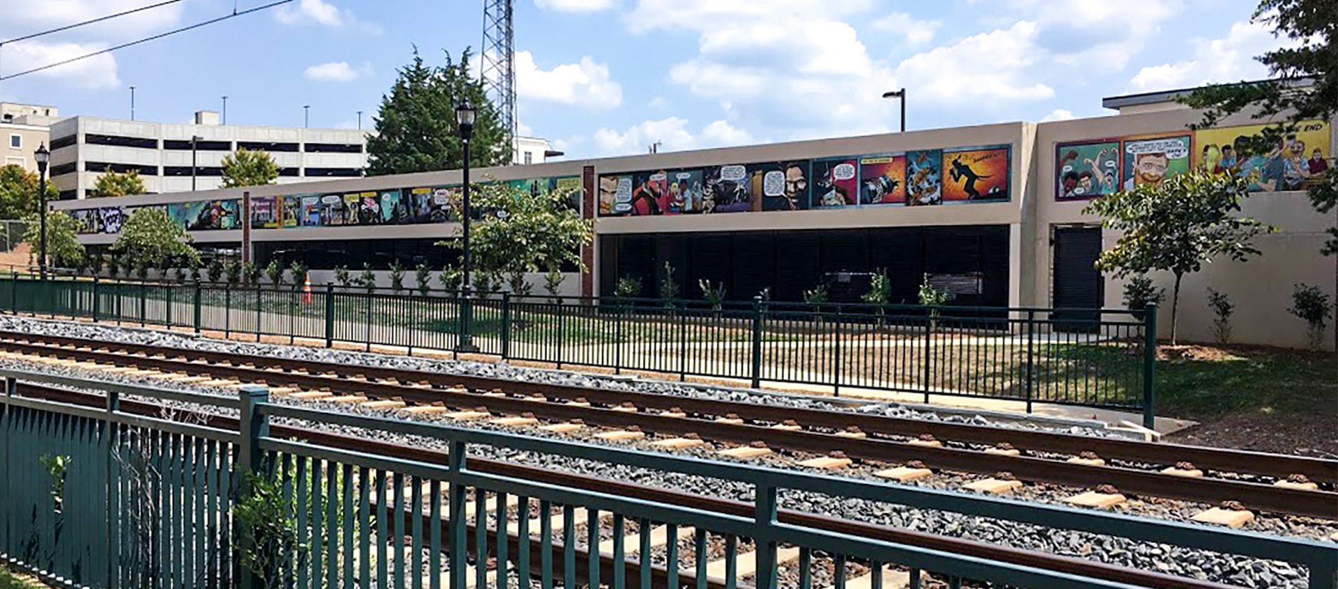 The Sting comic art on 2400 South Boulevard parking deck by LYNX light rail tracks