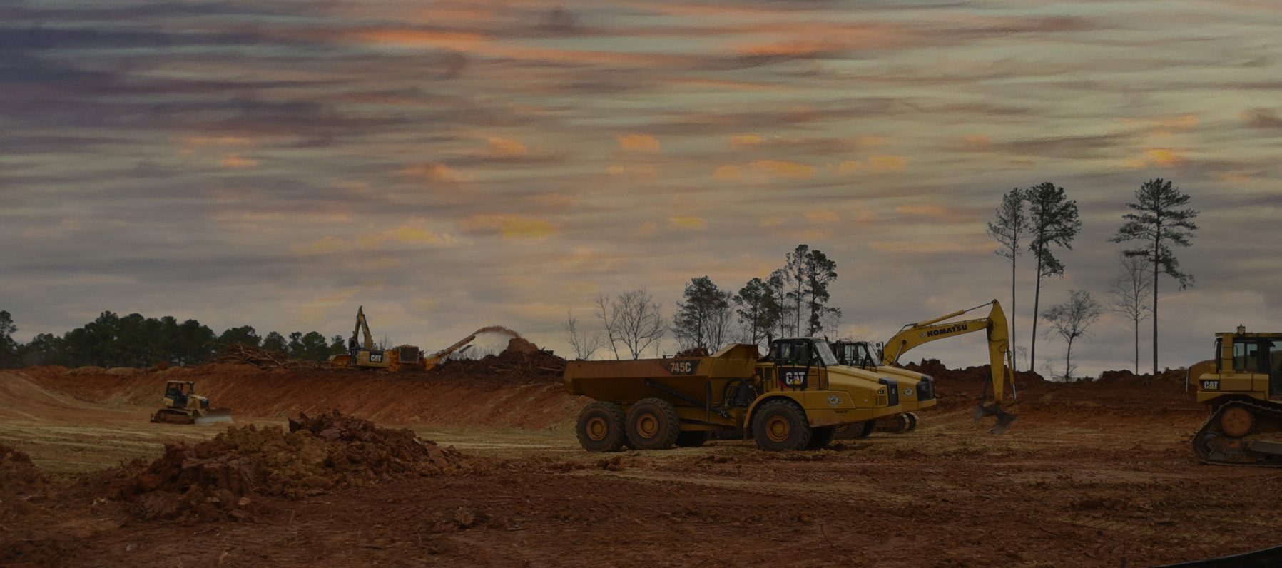 under construction equipment moving dirt