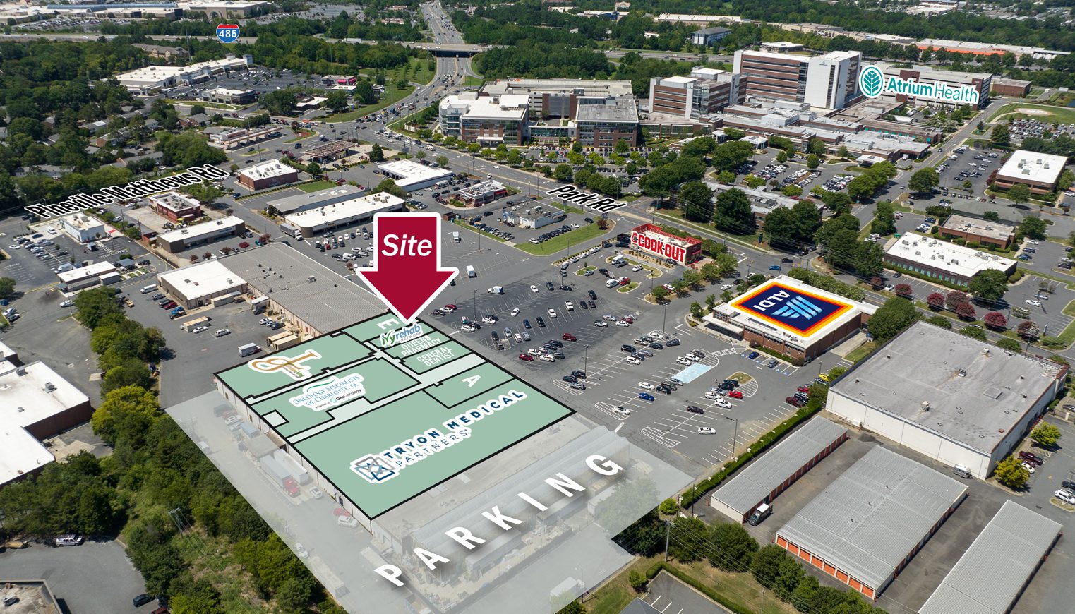 Aerial of commercial center with overlay listing tenants