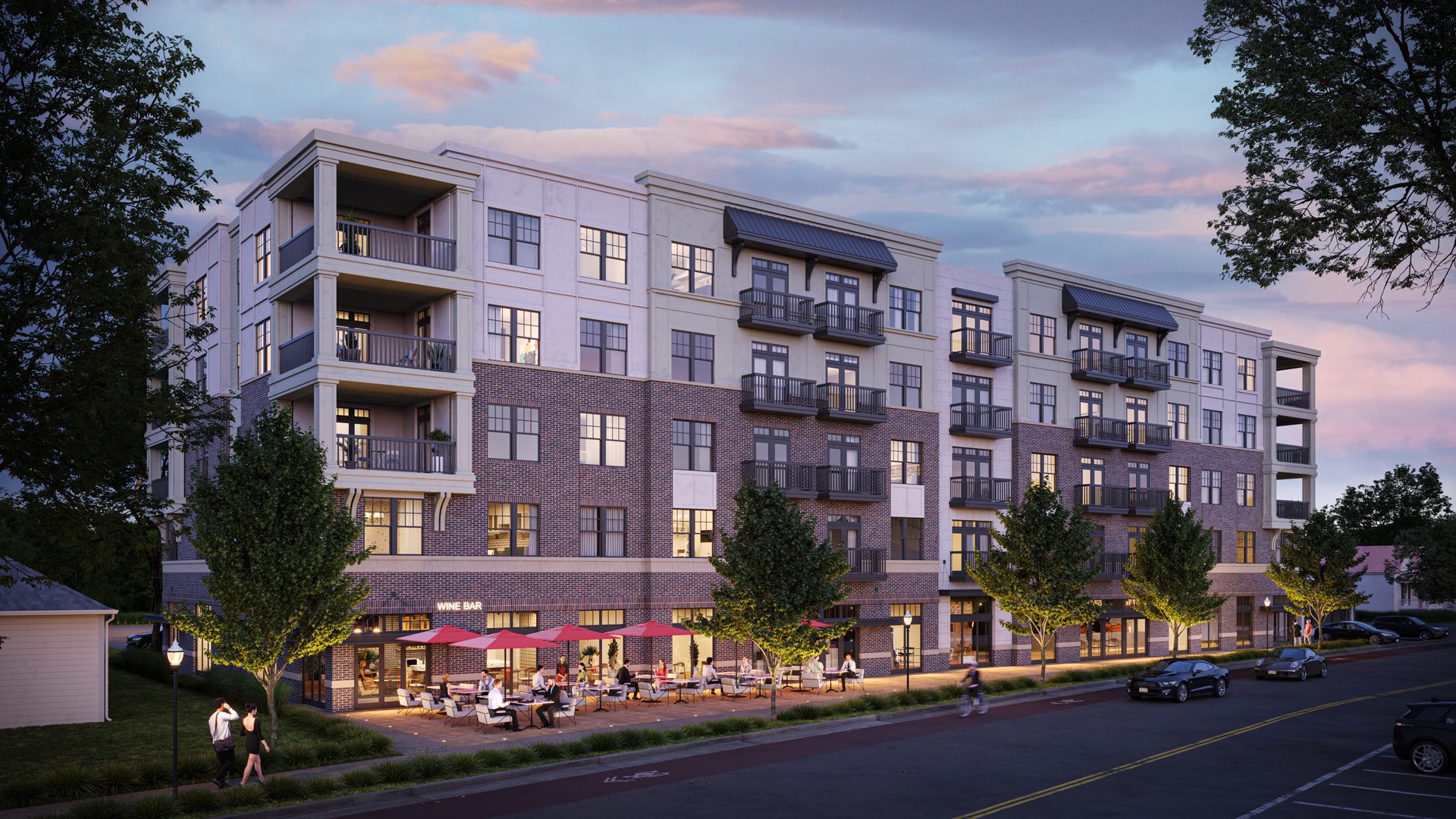 The Venue on South Main in Cornelius rendering of 5-story building at dusk with outdoor patio and residential above