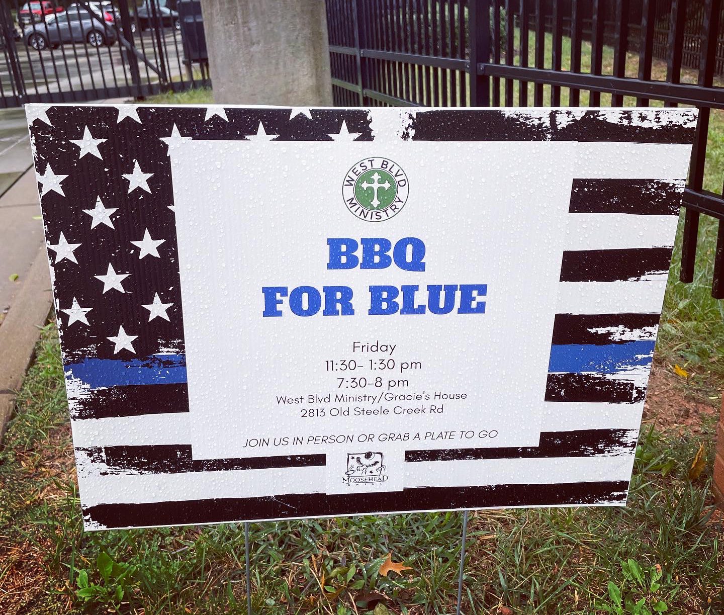 yard sign with info for BBQ For Blue hosted by West Blvd Ministries