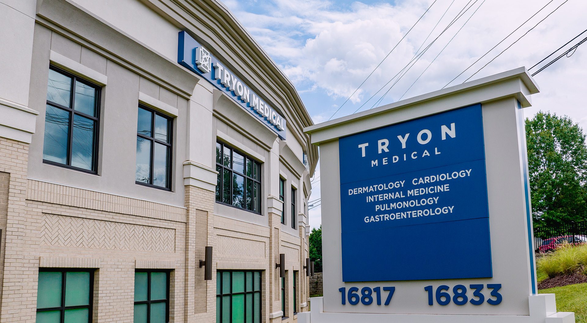 Tryon Medical Partners at Marvin Crossing center monument sign with 2-story building in background