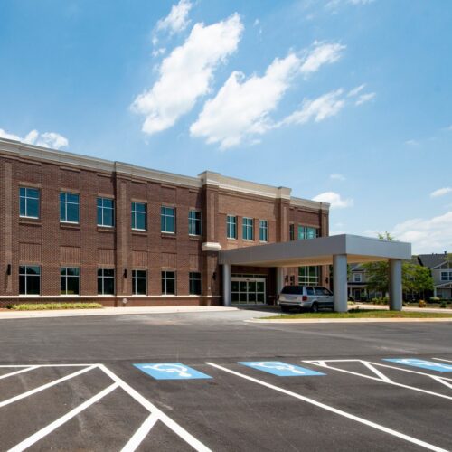 two story all brick medical office building with drive thru awning for medical