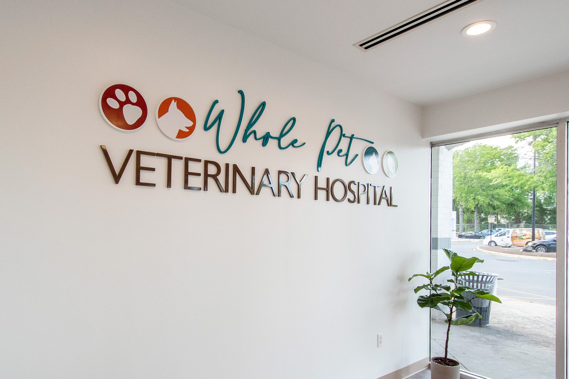 Whole Pet Veterinary Hospital interior sign of logo