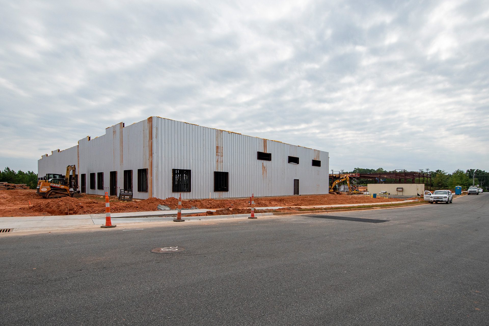 industrial flex building under construction with corrugated steel on outside of building