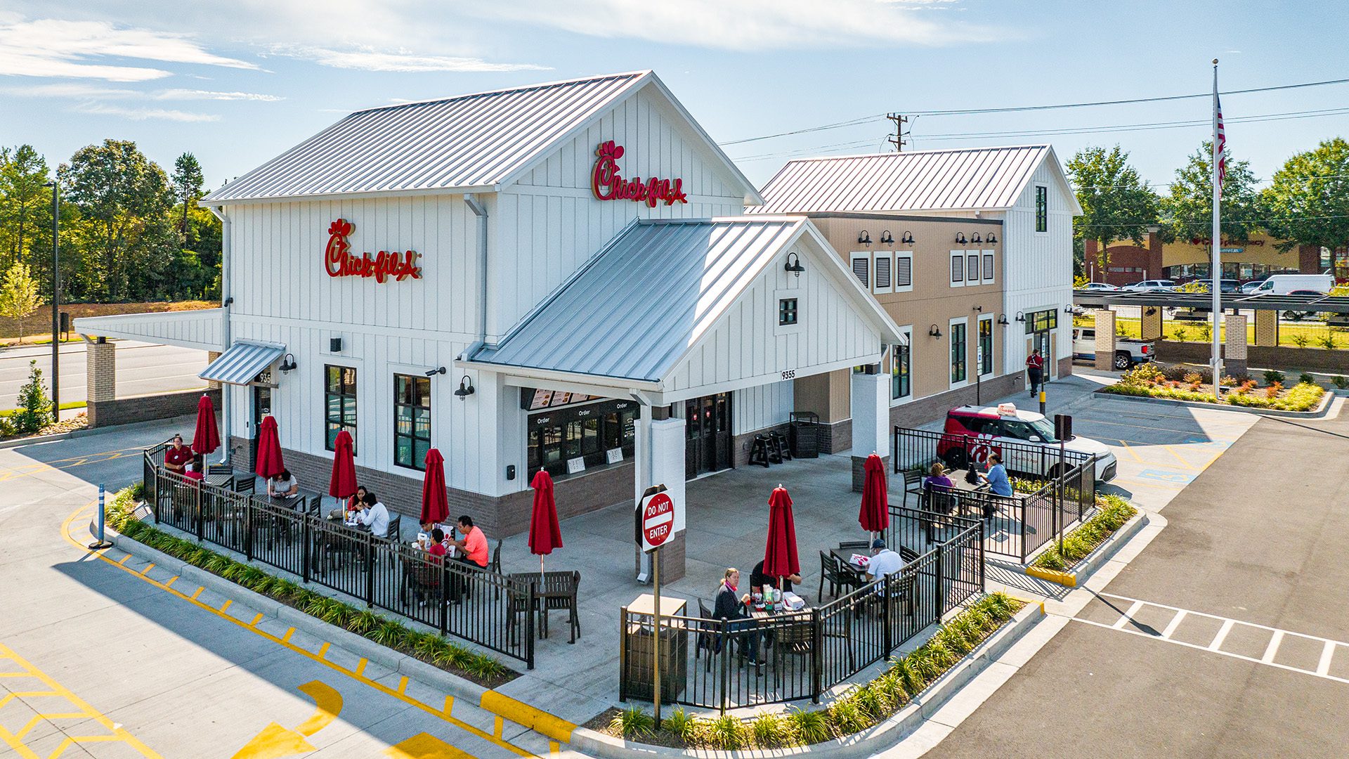 Chick-fil-A restaurant at Farmington white farm style building with patio seating