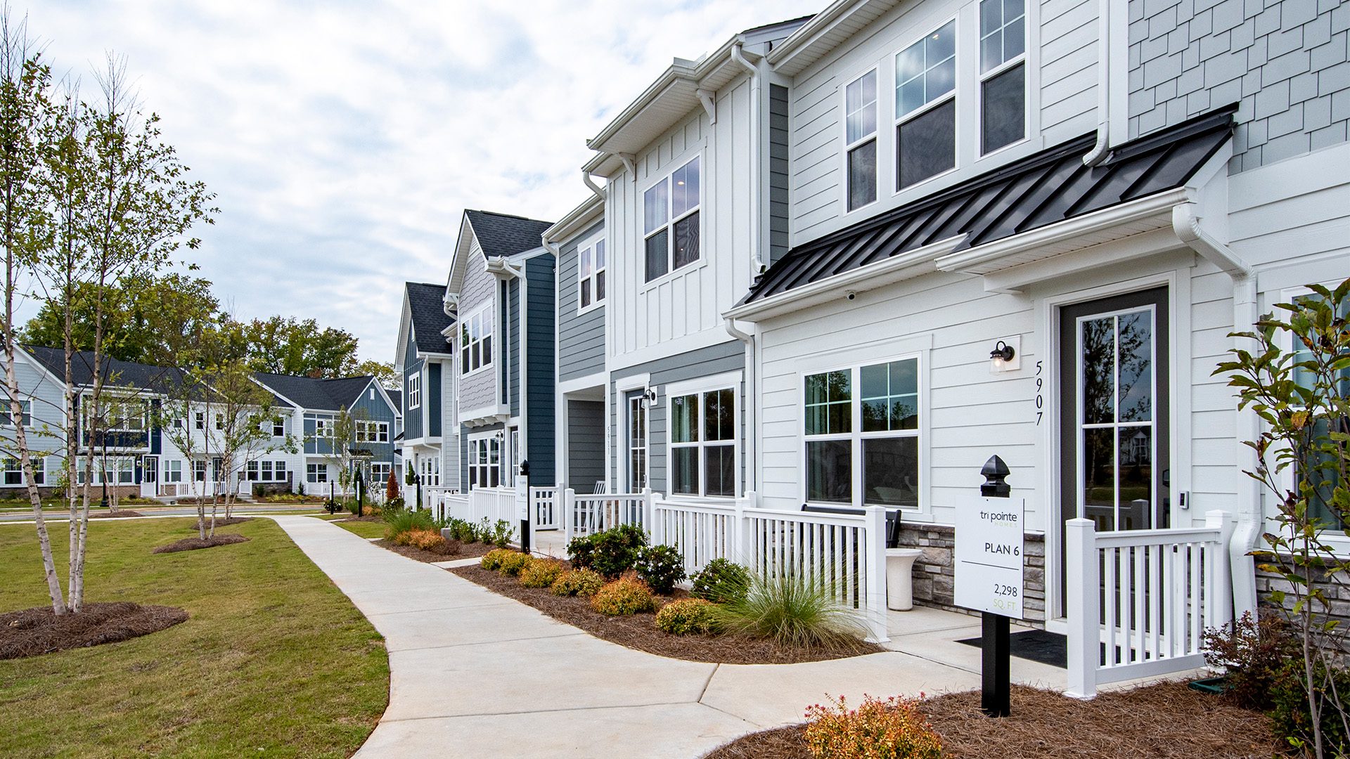 Tri Pointe Homes townhomes with blue and white exterior finishes