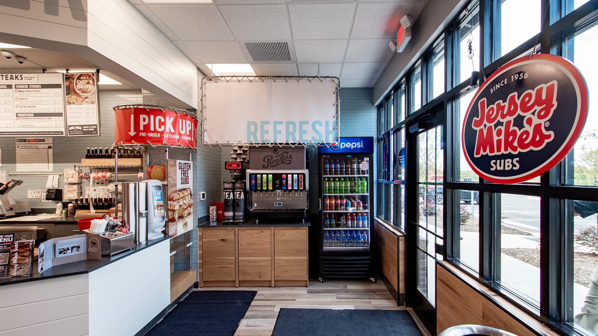 Jersey Mike's Subs interior at Farmington with drink station and pickup counter