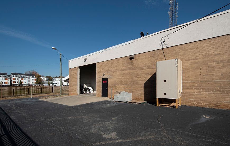 Exterior of Industrial Building with large Drive In Doors and pavement