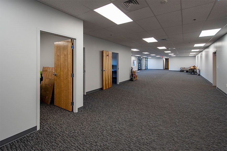 Hallway of office doors with carpet
