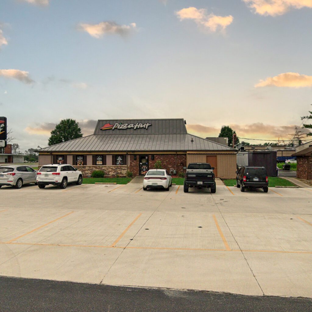 Pizza Hut Grey Brick Building with Parking lot