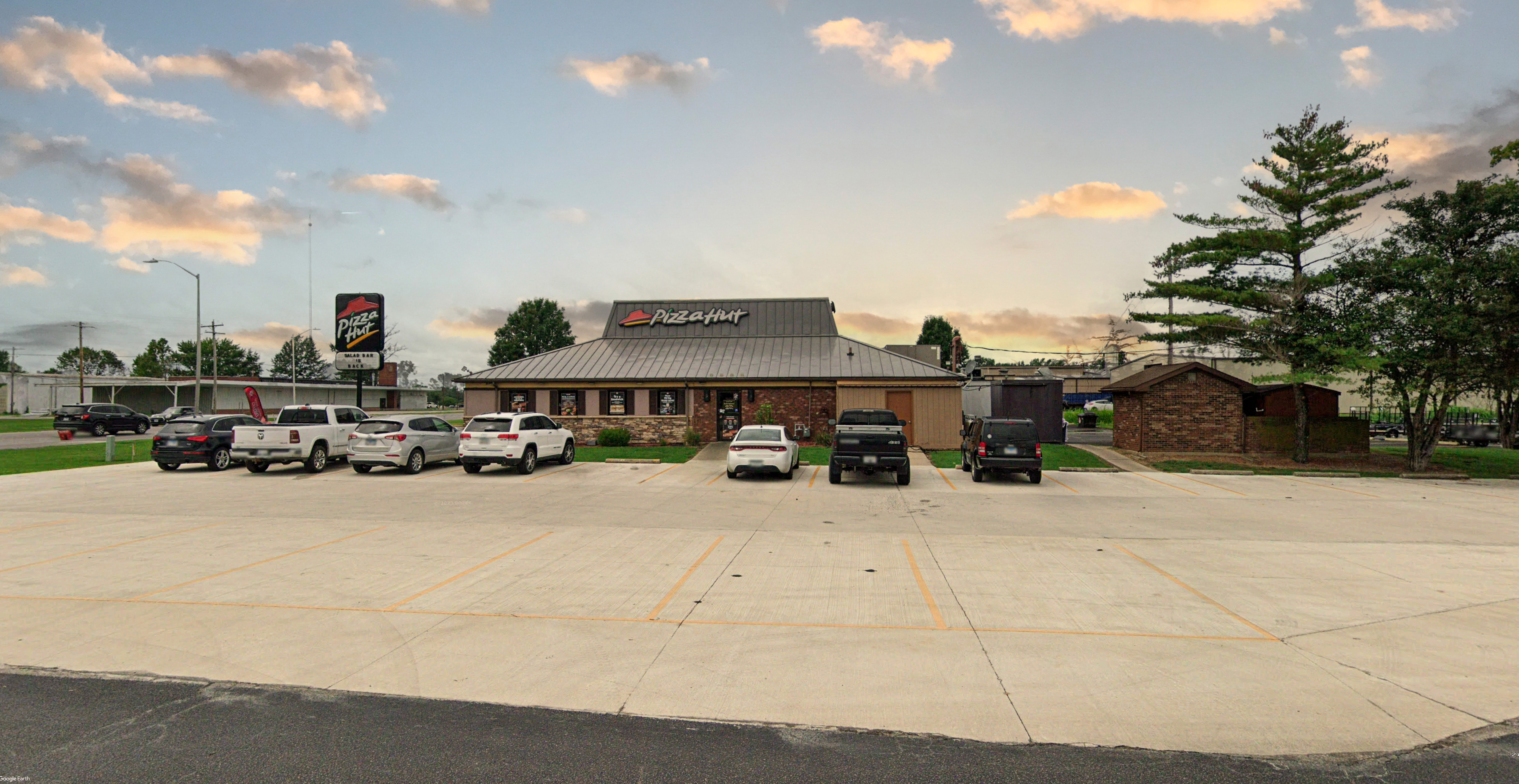 Pizza Hut Grey Brick Building with Parking lot