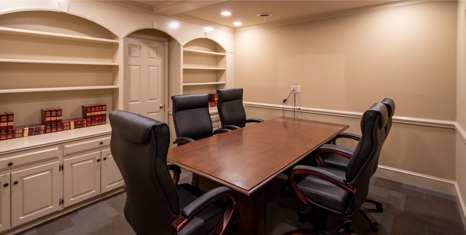 Conference room with chairs, table and cut outs in the wall
