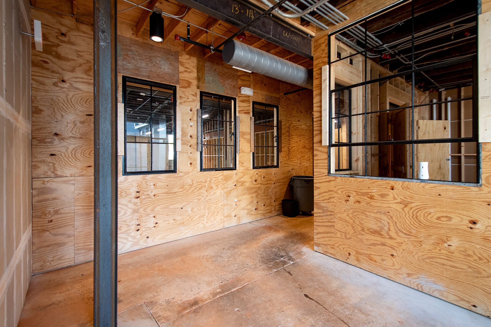interior entrance to retail space with exposed wood walls