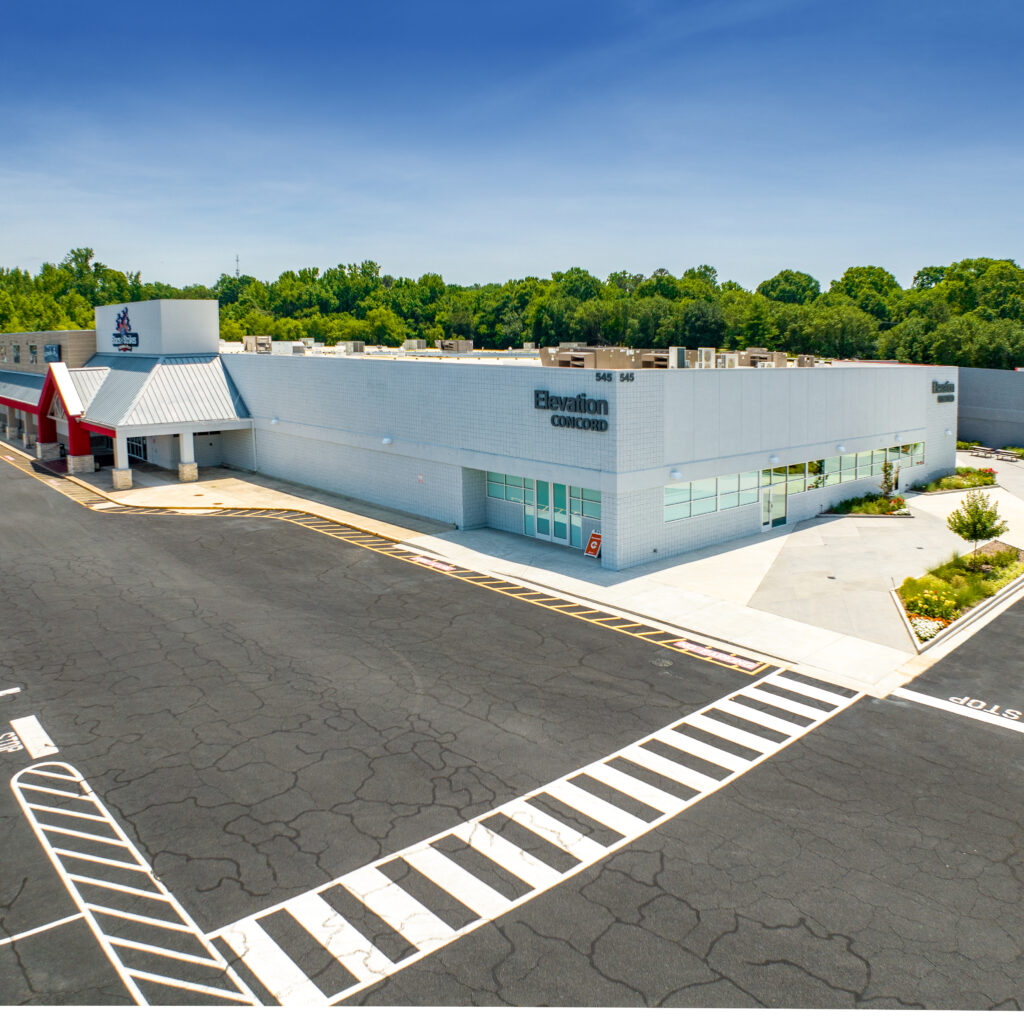 Large Adaptive Flex Center white building with parking lot