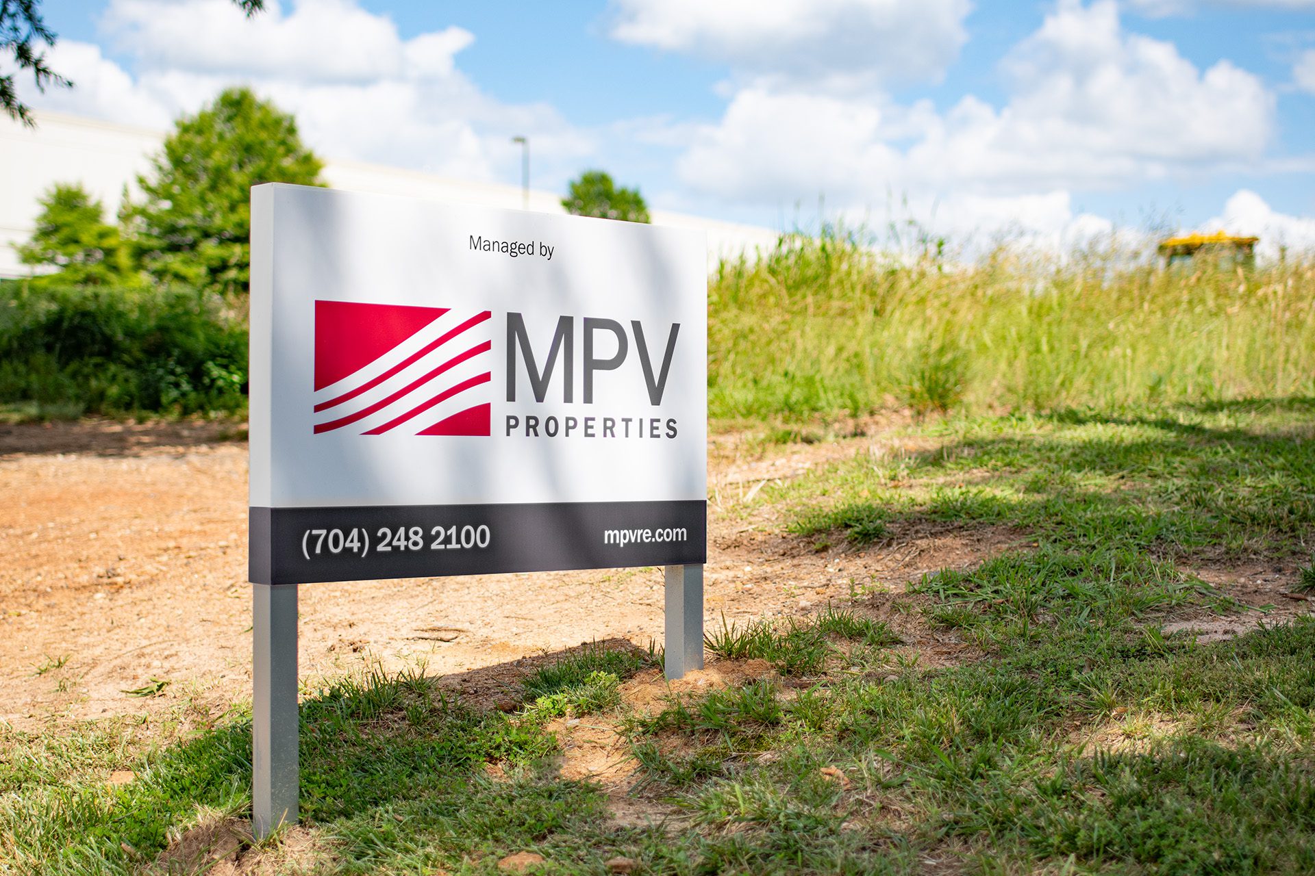 MPV Properties management sign in grass on a construction site