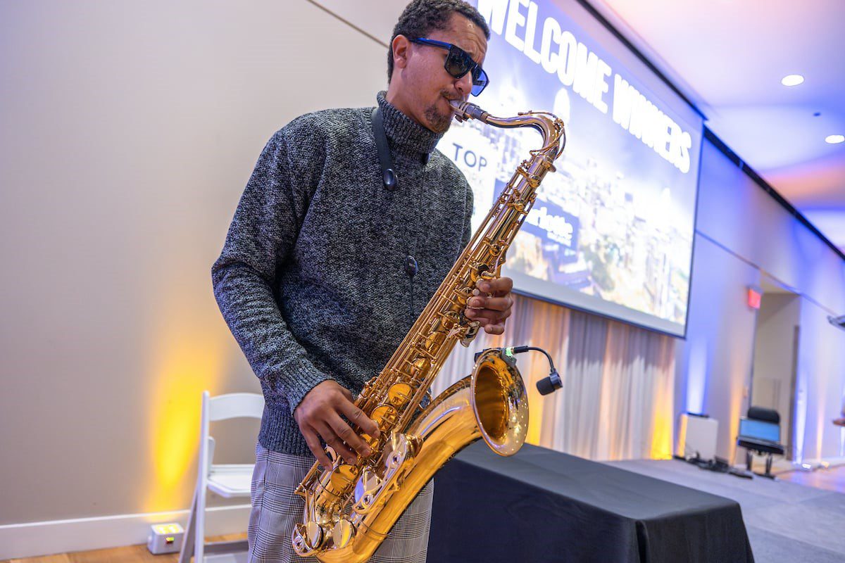 Charlotte Magazine's Top Workplaces event live saxophone player