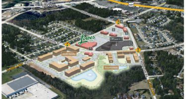 Academy Village in Fuquay-Varina, NC aerial master plan overlay with commercial and residential buildings