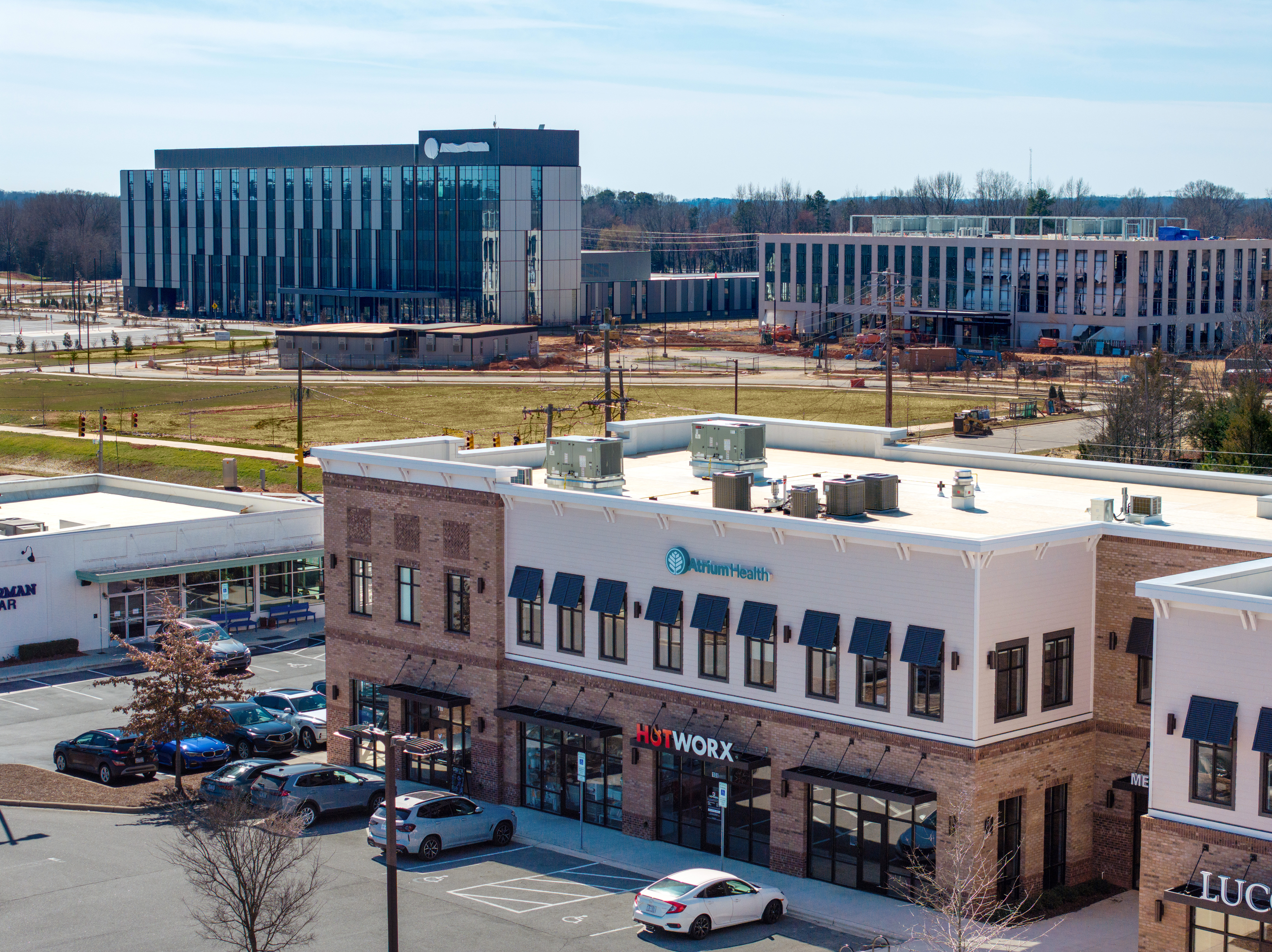 Brick Multi Tenant 2 story Building with parking lot with Atrium Sign