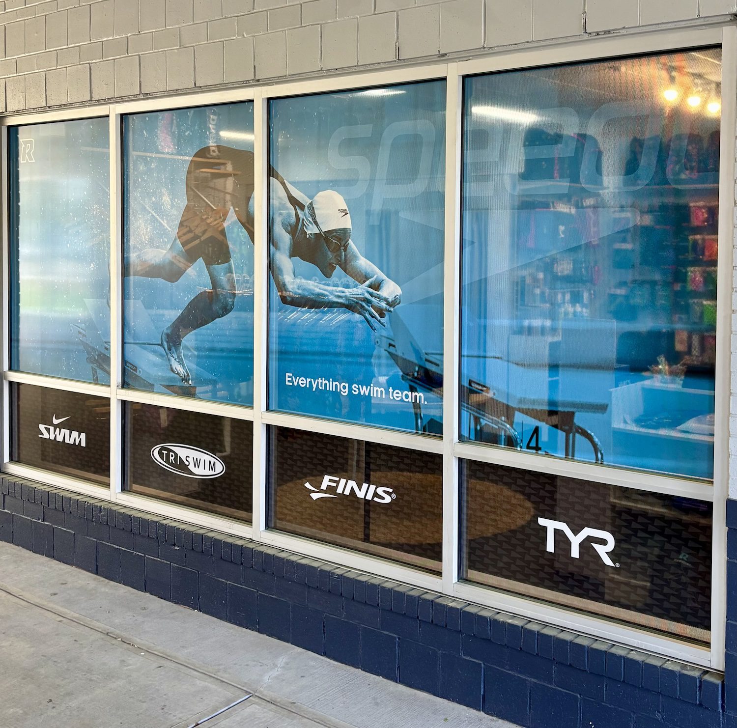 Reddiset swim team store window ads