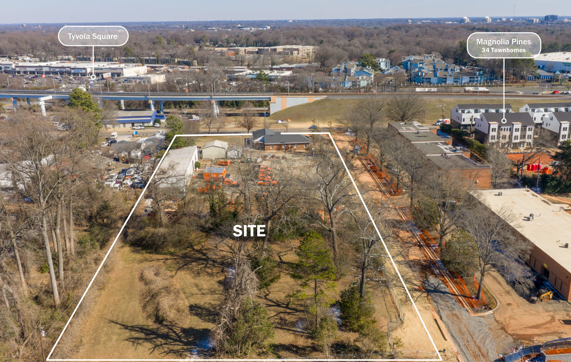 5970 Old Pineville Rd Site Aerial showing nearby residential development
