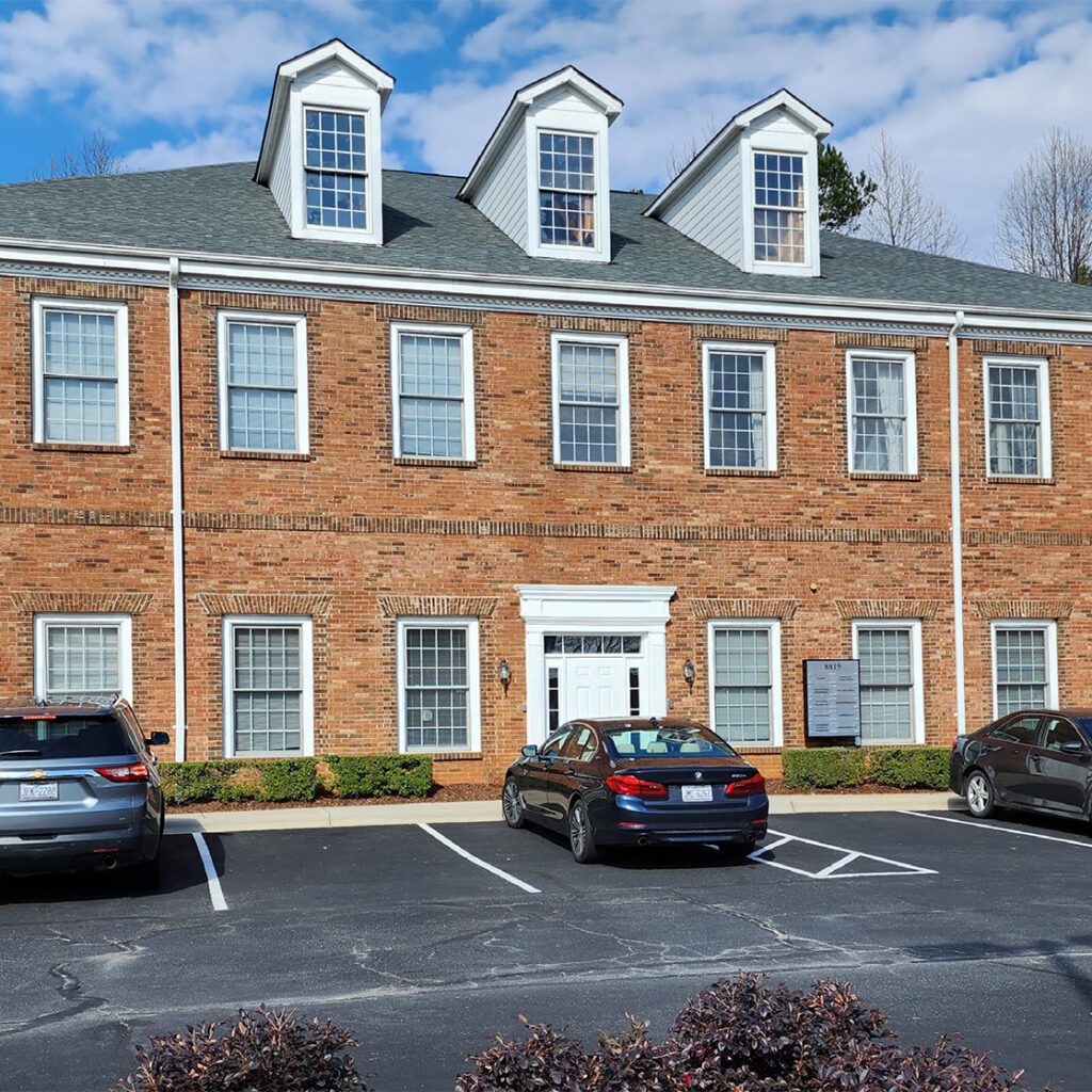 8819 University East exterior image 2-story brick office building