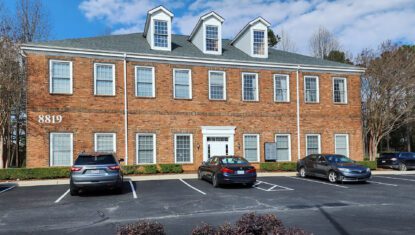 8819 University East exterior image 2-story brick office building