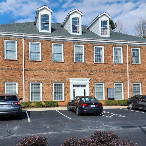 8819 University East exterior image 2-story brick office building