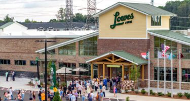 Lowes Foods grand opening view from outside with crowd of people walking into the store